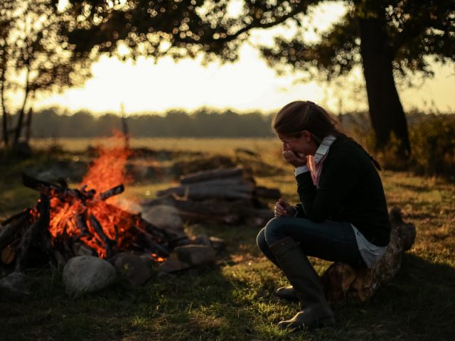 Girl by the fire
